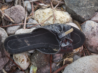 Woman's patent-leather mule found near Skala Sikaminias on the island of Lesbos.  Shoes found on the beaches and around the Greek island whe...