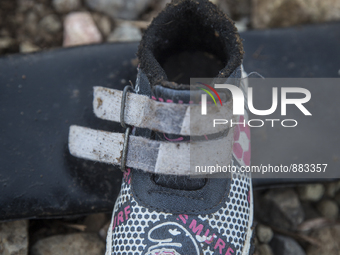 Child's synthetic Smurf sneaker found near Eftalou on the island of Lesbos.  Shoes found on the beaches and around the Greek island where th...