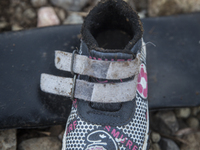 Child's synthetic Smurf sneaker found near Eftalou on the island of Lesbos.  Shoes found on the beaches and around the Greek island where th...