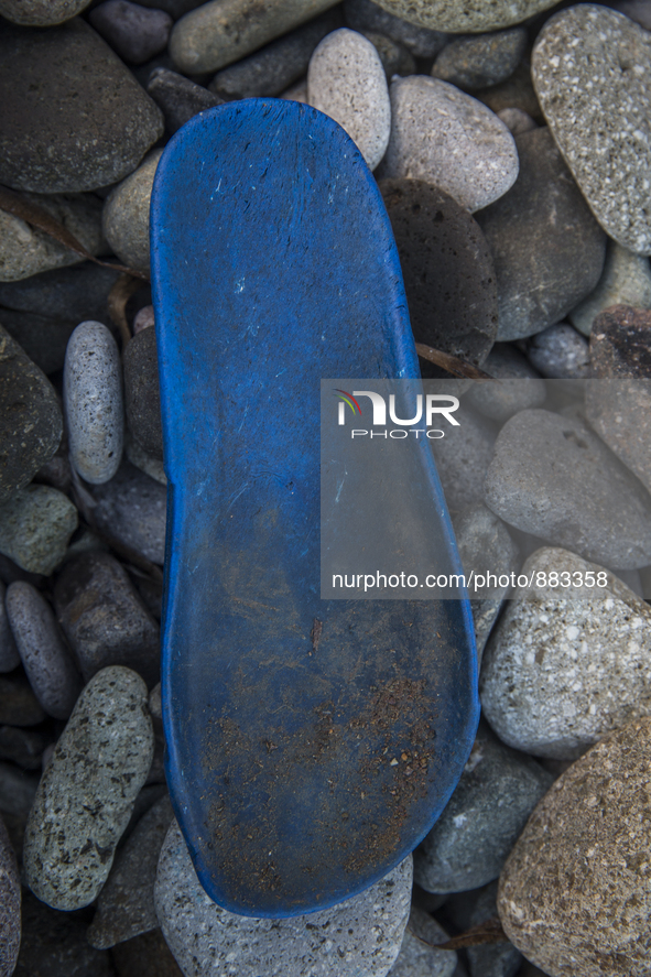 Part of a rubber flipflop found near Eftalou on the island of Lesbos.  Shoes found on the beaches and around the Greek island where thousand...