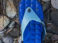 Blue rubber and plastic flipflop found near Eftalou on the island of Lesbos.  Shoes found on the beaches and around the Greek island where t...