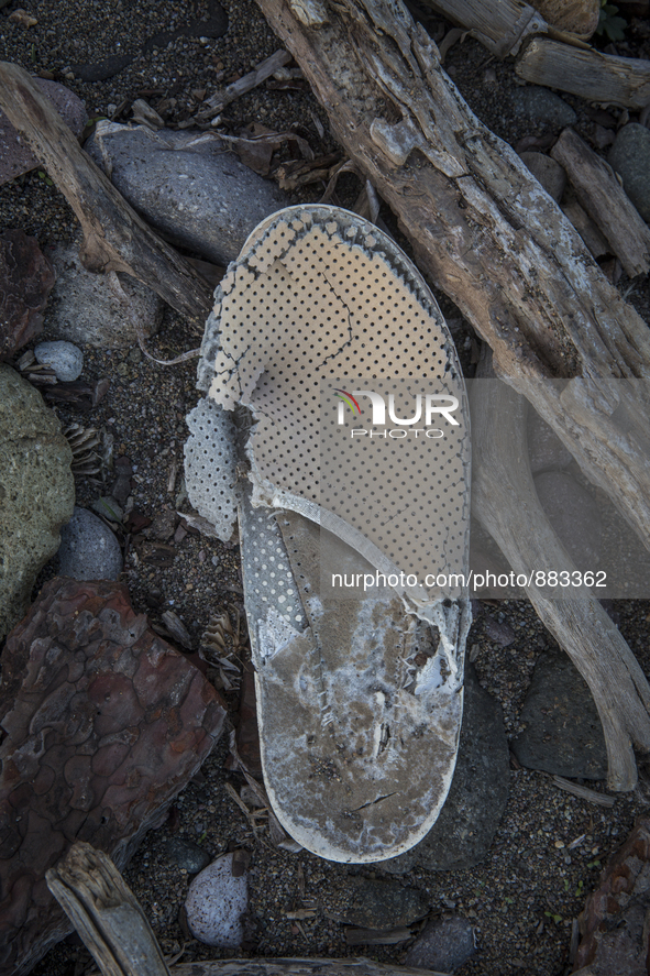 Slipper found near Eftalou on the island of Lesbos.  Shoes found on the beaches and around the Greek island where thousands of immigrants ar...