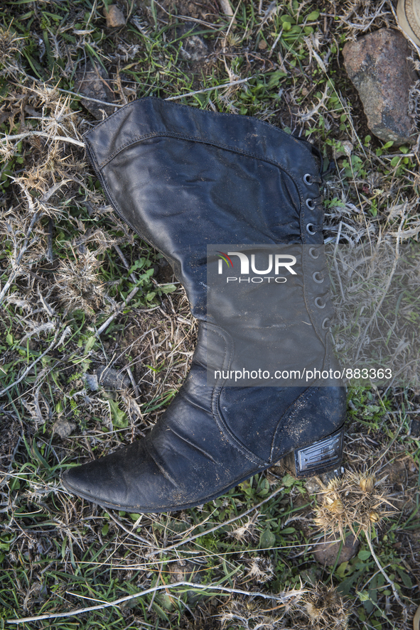 Woman's leather boot, found at the edge of Moria Camp, where immigrants must register with Greek authorities on the island of Lesbos, Greece...