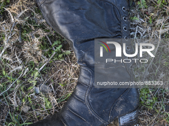 Woman's leather boot, found at the edge of Moria Camp, where immigrants must register with Greek authorities on the island of Lesbos, Greece...