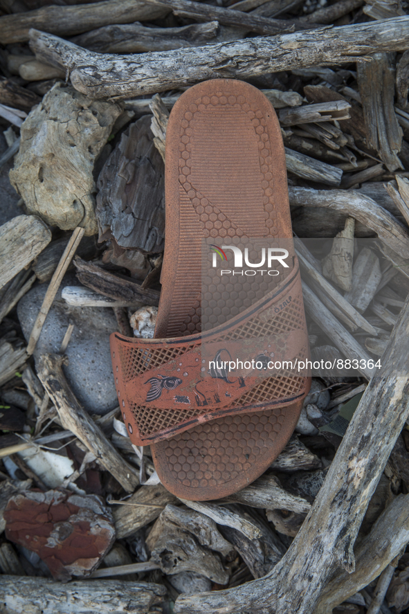 Rubber slipper found near Eftalou on the island of Lesbos.  Shoes found on the beaches and around the Greek island where thousands of immigr...