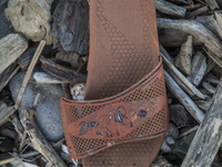 Rubber slipper found near Eftalou on the island of Lesbos.  Shoes found on the beaches and around the Greek island where thousands of immigr...