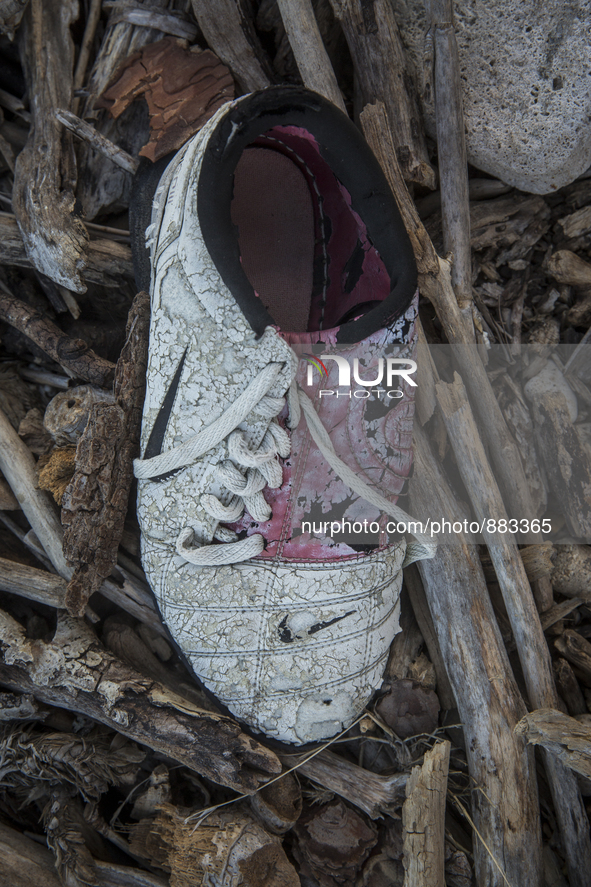 Nike football sneaker found near Eftalou on the island of Lesbos.  Shoes found on the beaches and around the Greek island where thousands of...