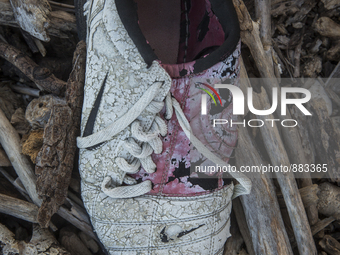 Nike football sneaker found near Eftalou on the island of Lesbos.  Shoes found on the beaches and around the Greek island where thousands of...