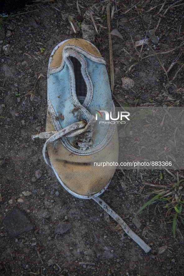 Child's sneaker found near Eftalou on the island of Lesbos.  Shoes found on the beaches and around the Greek island where thousands of immig...