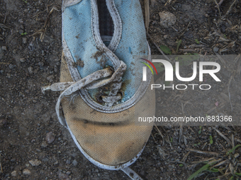 Child's sneaker found near Eftalou on the island of Lesbos.  Shoes found on the beaches and around the Greek island where thousands of immig...