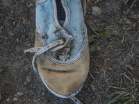 Child's sneaker found near Eftalou on the island of Lesbos.  Shoes found on the beaches and around the Greek island where thousands of immig...