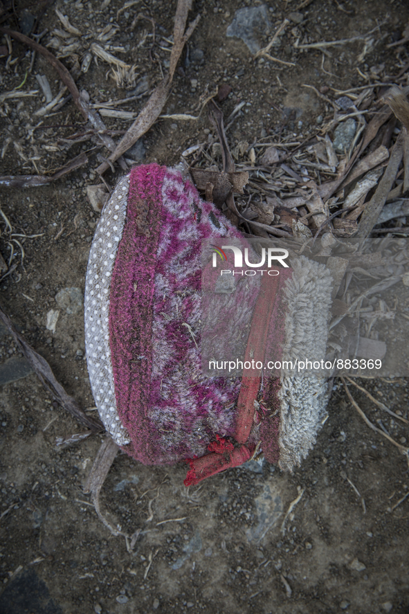 Infant slipper found near Eftalou on the island of Lesbos.  Shoes found on the beaches and around the Greek island where thousands of immigr...