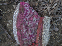 Infant slipper found near Eftalou on the island of Lesbos.  Shoes found on the beaches and around the Greek island where thousands of immigr...