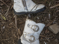 Girl's imitation leather boots with buckles found near Eftalou on the island of Lesbos.  Shoes found on the beaches and around the Greek isl...