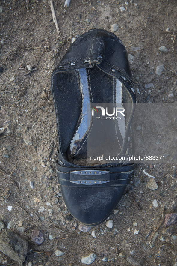 Woman's leather shoe with buckle found near Eftalou on the island of Lesbos.  Shoes found on the beaches and around the Greek island where t...