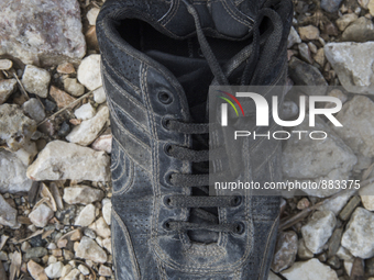 Men's leather shoe, found at the edge of Moria Camp, where immigrants must register with Greek authorities on the island of Lesbos, Greece....