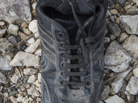 Men's leather shoe, found at the edge of Moria Camp, where immigrants must register with Greek authorities on the island of Lesbos, Greece....