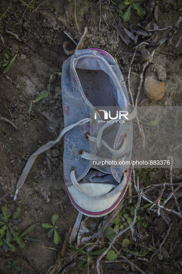 Child's sneaker found near Eftalou on the island of Lesbos.  Shoes found on the beaches and around the Greek island where thousands of immig...