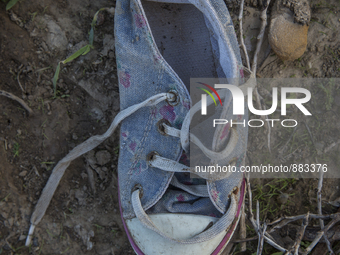 Child's sneaker found near Eftalou on the island of Lesbos.  Shoes found on the beaches and around the Greek island where thousands of immig...