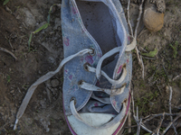 Child's sneaker found near Eftalou on the island of Lesbos.  Shoes found on the beaches and around the Greek island where thousands of immig...