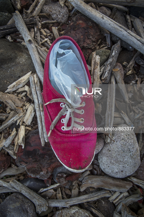 Woman's red canvas with plastic bags inside found near Eftalou on the island of Lesbos.  Shoes found on the beaches and around the Greek isl...