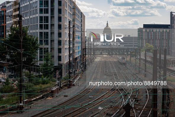 The U.S. Capitol is seen beyond commuter and freight railway tracks in Washington, D.C. on September 14, 2022 as a potential nationwide labo...