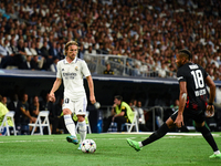 Luka Modric and Christopher Nkunku during UEFA Champions League match between Real Madrid and RB Leipzig at Estadio Santiago Bernabeu on Sep...