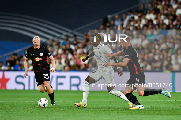 Vinicius Junior, Willi Orban and Xaver Schlager during UEFA Champions League match between Real Madrid and RB Leipzig at Estadio Santiago Be...