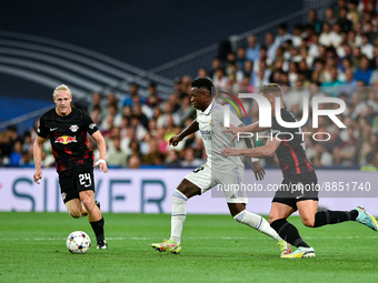 Vinicius Junior, Willi Orban and Xaver Schlager during UEFA Champions League match between Real Madrid and RB Leipzig at Estadio Santiago Be...