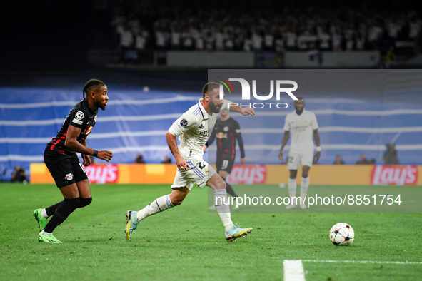 Daniel Carvajal and Christopher Nkunku during UEFA Champions League match between Real Madrid and RB Leipzig at Estadio Santiago Bernabeu on...