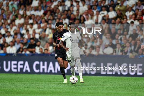 Vinicius Junior and Mohamed Simakan during UEFA Champions League match between Real Madrid and RB Leipzig at Estadio Santiago Bernabeu on Se...