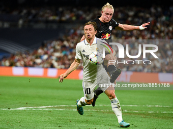 Luka Modric and Xaver Schlager during UEFA Champions League match between Real Madrid and RB Leipzig at Estadio Santiago Bernabeu on Septemb...