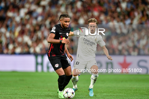 Christopher Nkunku and Luka Modric during UEFA Champions League match between Real Madrid and RB Leipzig at Estadio Santiago Bernabeu on Sep...