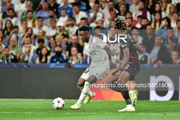 Vinicius Junior and Mohamed Simakan during UEFA Champions League match between Real Madrid and RB Leipzig at Estadio Santiago Bernabeu on Se...