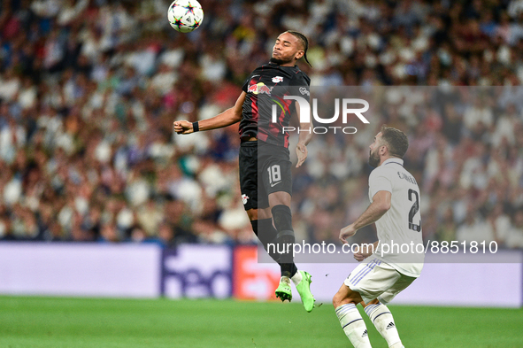 Christopher Nkunku and Daniel Carvajal during UEFA Champions League match between Real Madrid and RB Leipzig at Estadio Santiago Bernabeu on...