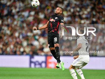 Christopher Nkunku and Daniel Carvajal during UEFA Champions League match between Real Madrid and RB Leipzig at Estadio Santiago Bernabeu on...