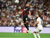 Christopher Nkunku and Daniel Carvajal during UEFA Champions League match between Real Madrid and RB Leipzig at Estadio Santiago Bernabeu on...