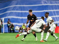 Dominik Szoboszlai, David Alaba and Eduardo Camavinga during UEFA Champions League match between Real Madrid and RB Leipzig at Estadio Santi...