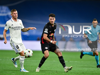 Dominik Szoboszlai and Toni Kroos during UEFA Champions League match between Real Madrid and RB Leipzig at Estadio Santiago Bernabeu on Sept...