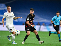 Dominik Szoboszlai and Toni Kroos during UEFA Champions League match between Real Madrid and RB Leipzig at Estadio Santiago Bernabeu on Sept...