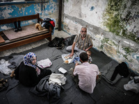 People eat in Leros Refugee Camp, Greece, on October 30, 2015. Refugee camp Leros, located on the Greek Island of Leros is a transit camp fo...