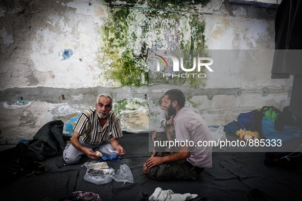 People eat in Leros Refugee Camp, Greece, on October 30, 2015. Refugee camp Leros, located on the Greek Island of Leros is a transit camp fo...