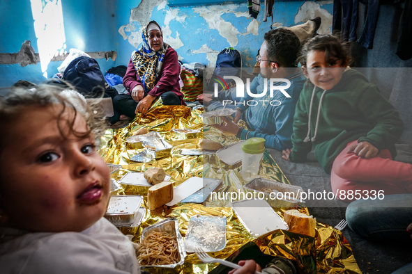 A family in Leros Refugee Camp, Greece, on October 30, 2015. Refugee camp Leros, located on the Greek Island of Leros is a transit camp for...