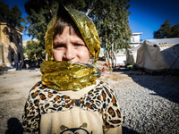 A child in Leros Refugee Camp, on October 30, 2015. Refugee camp Leros, located on the Greek Island of Leros is a transit camp for refugees...