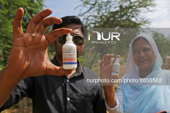 Members of Vishwa Hindu Parishad show dose of homeopathic medicine to a cow suffering from lumpy skin disease, in Jaipur, Rajasthan, India,...