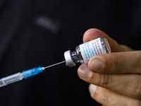 Medical personnel prepares a syringe with the vaccine against smallpox and monkeypox at Checkpoint Bln in Berlin, Germany on September 16, 2...