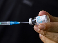 Medical personnel prepares a syringe with the vaccine against smallpox and monkeypox at Checkpoint Bln in Berlin, Germany on September 16, 2...