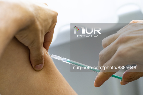 Medical personnel injects the vaccine against smallpox and monkeypox to a patient at Checkpoint Bln in Berlin, Germany on September 16, 2022...