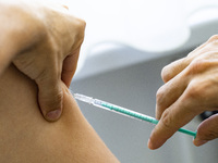 Medical personnel injects the vaccine against smallpox and monkeypox to a patient at Checkpoint Bln in Berlin, Germany on September 16, 2022...