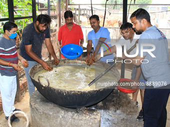   Social worker Nitesh Khandelwal and his team members  prepare ayurvedic medicine for cows after lumpy skin disease  outbreak in cattle, at...